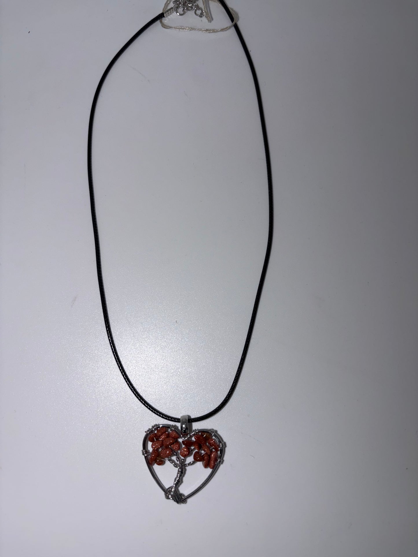 Heart stone wrapped with black cord